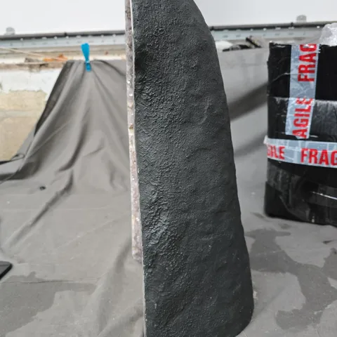 AMETHYST GEODE SLICE ON DARK ROCK BASE