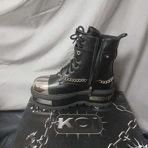 BOXED PAIR OF KOI VEGAN LEATHER BORIN HARDWARE PLATFORM BOOTS IN BLACK UK SIZE 5