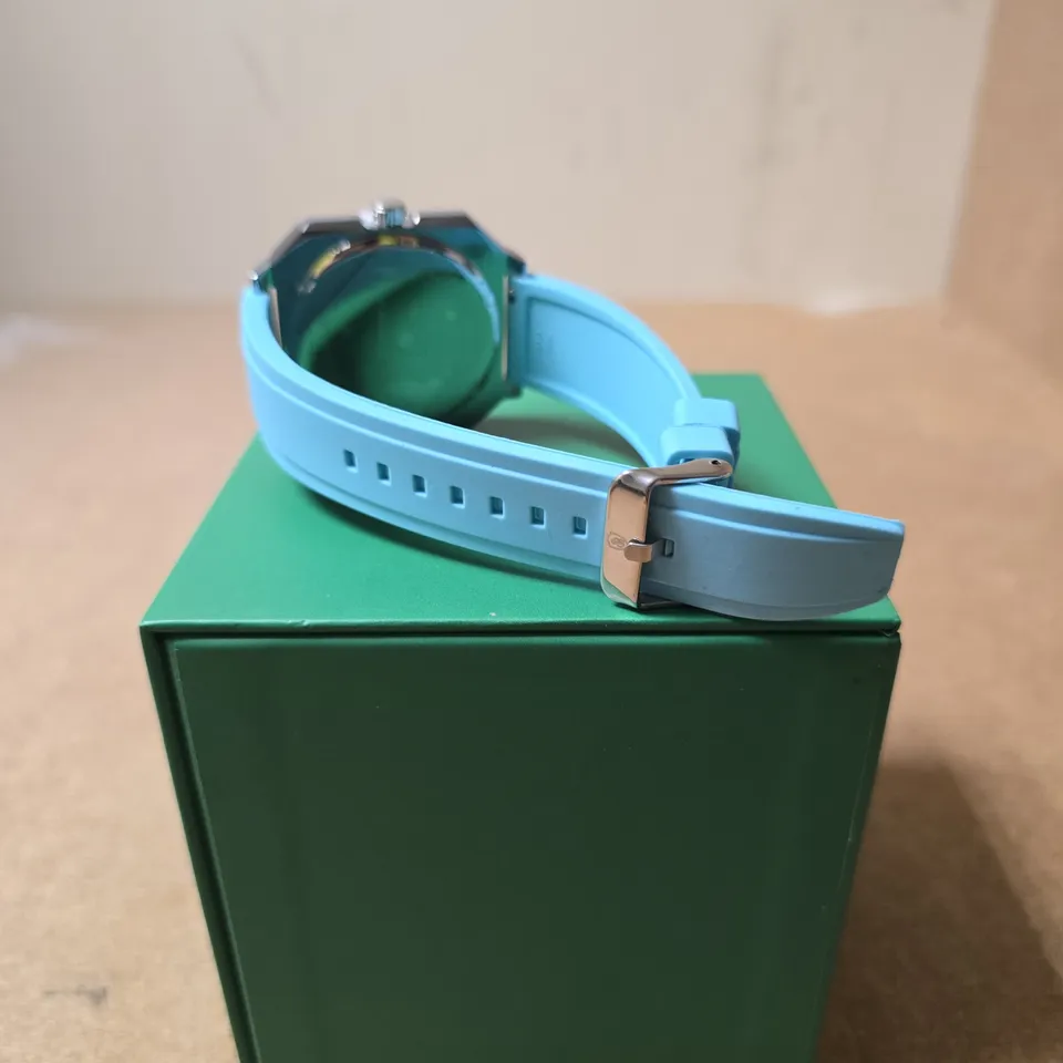 SCHWARTZBAUER ROULETTE WHEEL WRISTWATCH WITH TURQUOISE SILICONE STRAP