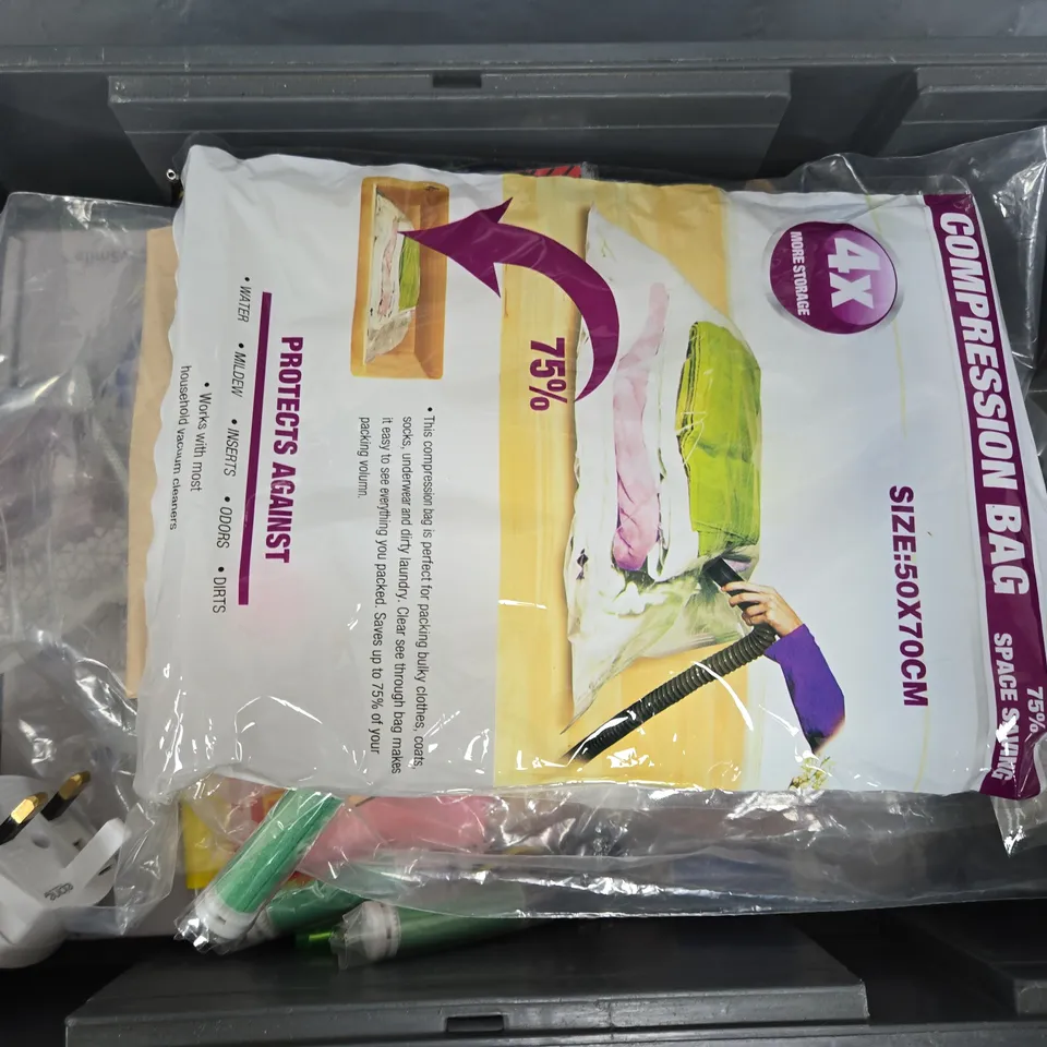 APPROXIMATELY 12 ASSORTED HOUSEHOLD ITEMS TO INCLUDE WINDOW INSULATION KIT, COMPRESSION BAG, CARD SLEEVES, ETC
