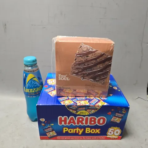 APPROXIMATELY 6 ASSORTED FOOD & DRINK ITEMS TO INCLUDE - HARIBO PARTY BOX , FREE SOUL  12 VEGAN PROTEIN BARS , LUCOZADE BLUE BURST ETC
