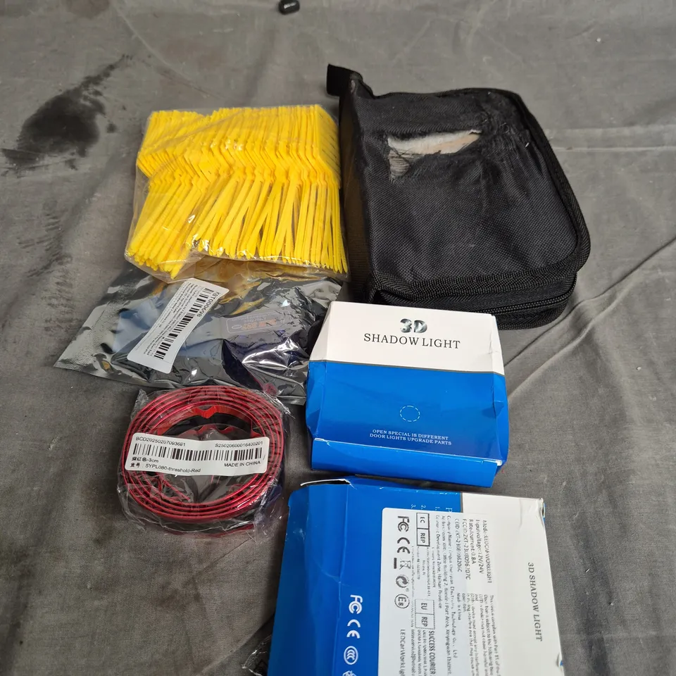 TOTE OF APPROXIMATELY. 10 ASSORTED CAR ITEMS TO INCLUDE SHADOW LIGHTS , AIR FRESHENERS AND CAR BADGES 