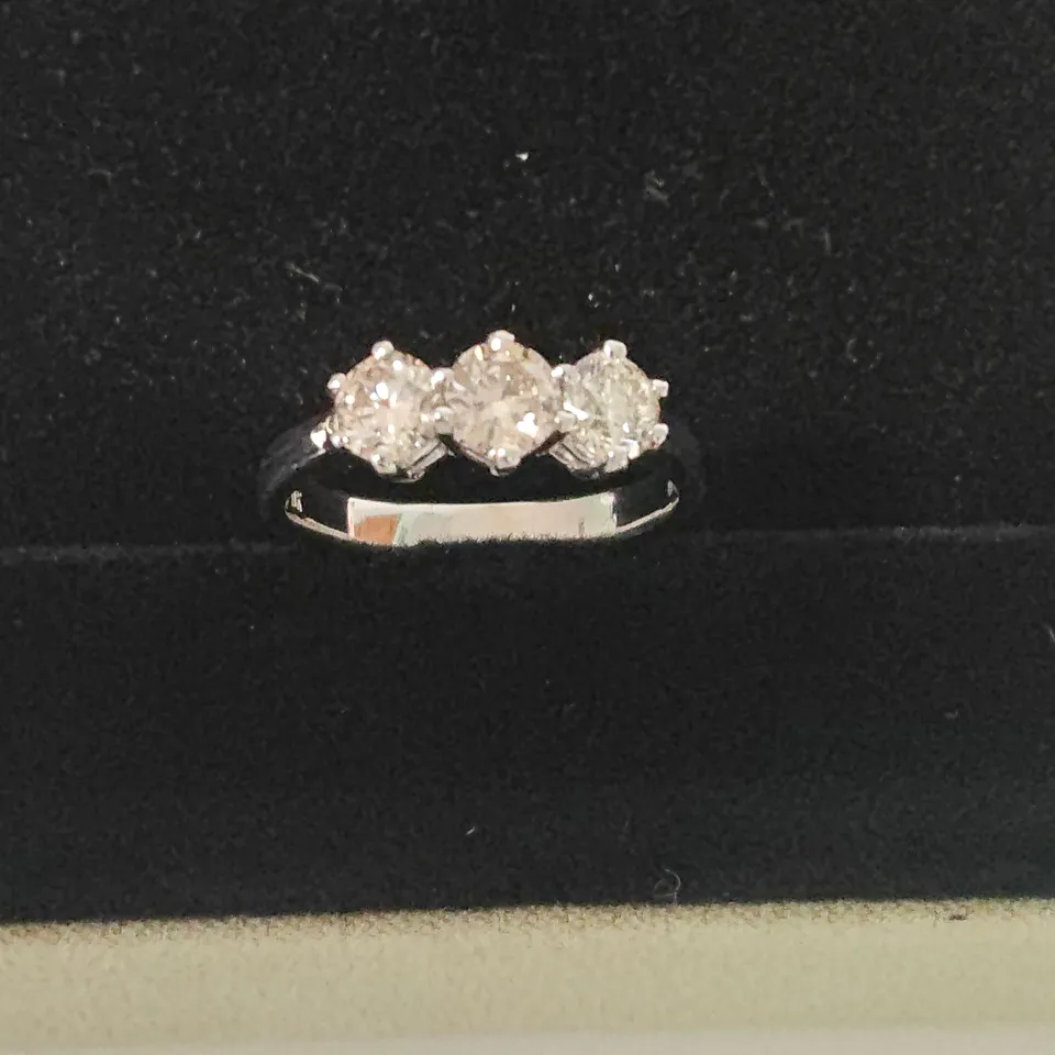18CT WHITE GOLD THREE STONE RING SET WITH A NATURAL DIAMOND WEIGHING +-1.01CT