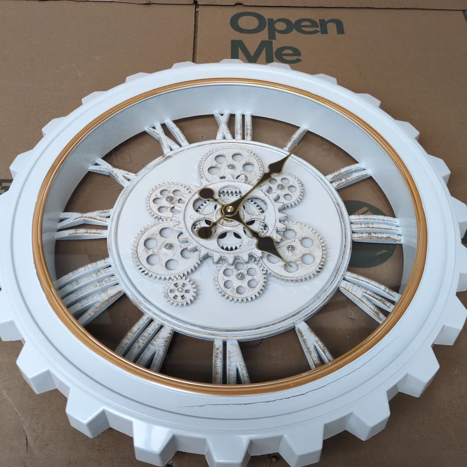 WHITE ROTATING GEAR WALL CLOCK FEATURES ROMAN NUMERALS