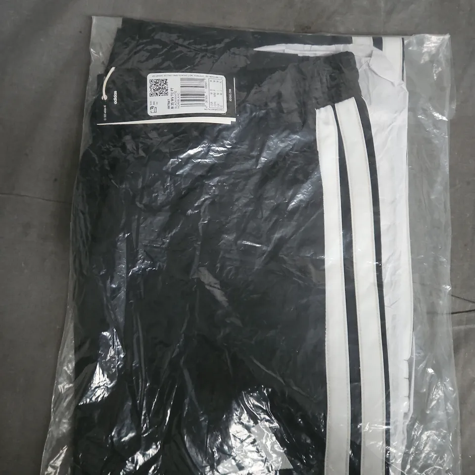 BLACK TRACK PANTS WITH WHITE SIDE STRIPES – SEALED IN PLASTIC PACKAGING  SIZE M