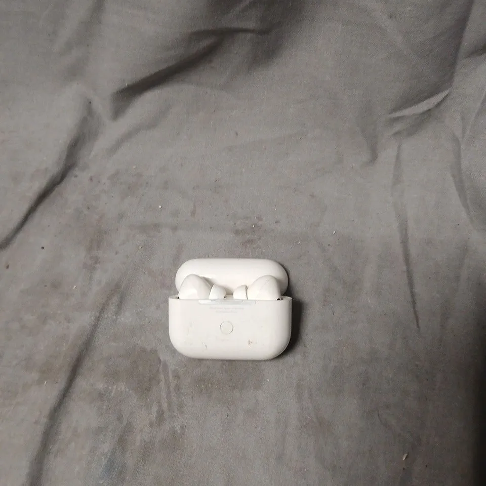 WHITE WIRELESS EARBUDS WITH CHARGING CASE. MODEL UNSPECIFIED.