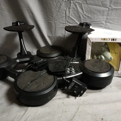 BOX OF APPROXIMATELY 10 ASSORTED ITEMS TO INCLUDE MONEY BOX, CLIFTON SMALL ELECTRONIC DRUM SET, ETC - COLLECTION ONLY
