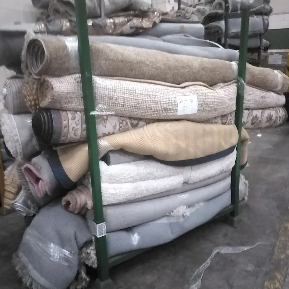STILLAGE OF APPROXIMATELY 25 DESIGNER RUGS