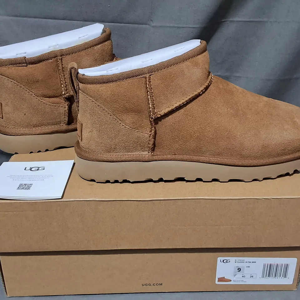 BOXED PAIR OF UGG CLASSIC ULTRA MINI BOOTS IN BROWN - UK 7