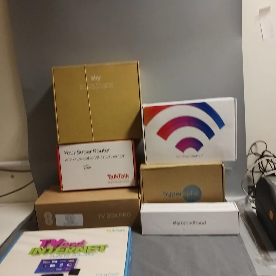 LARGE BOX OF ASSORTED BROADBAND/HOME NETWORKING ITEMS TO INCLUDE BRANDS LIKE SKY, VIRGIN, THREE, AND TALKTALK ETC.