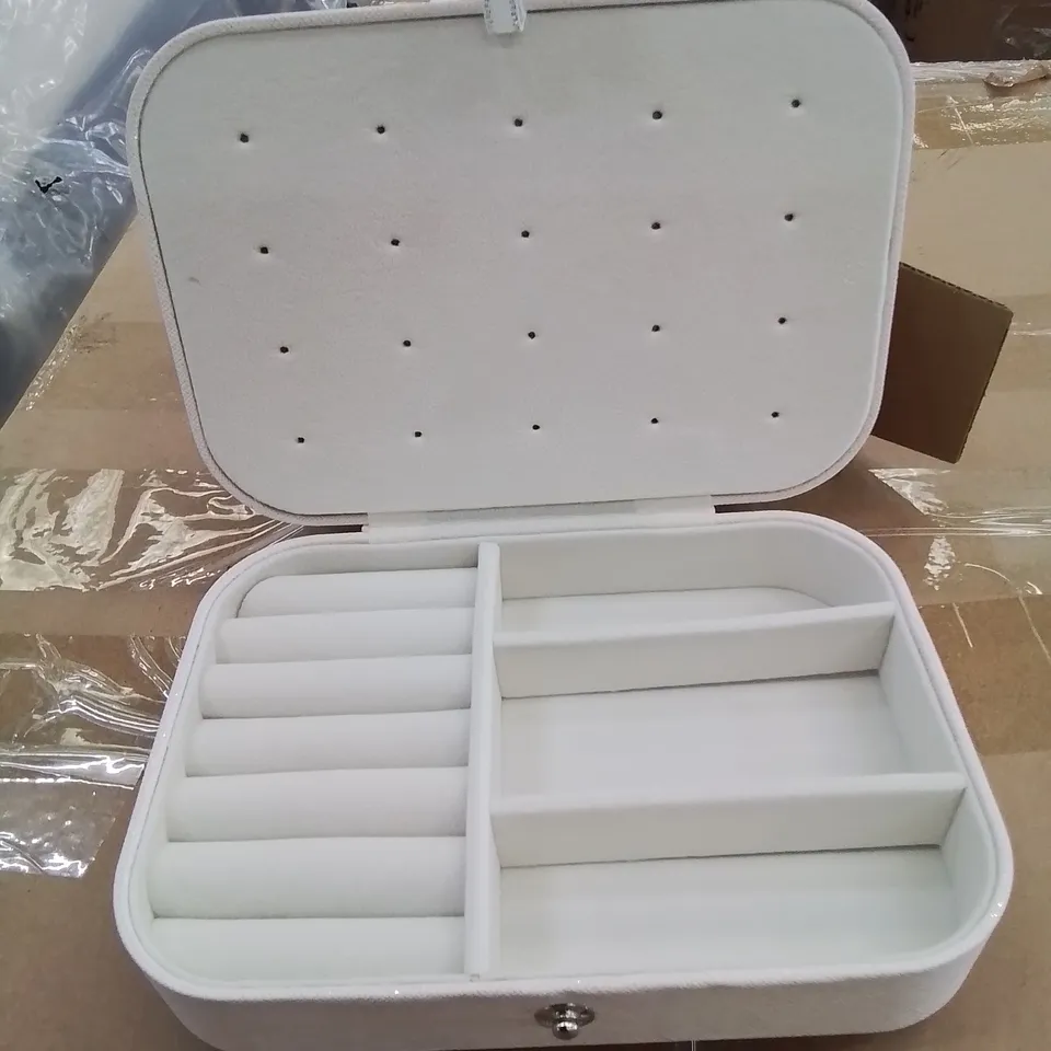 A BOX OF APPROXIMATELY 50 VANITY CASES IN WHITE WITH GLITTER EFFECT