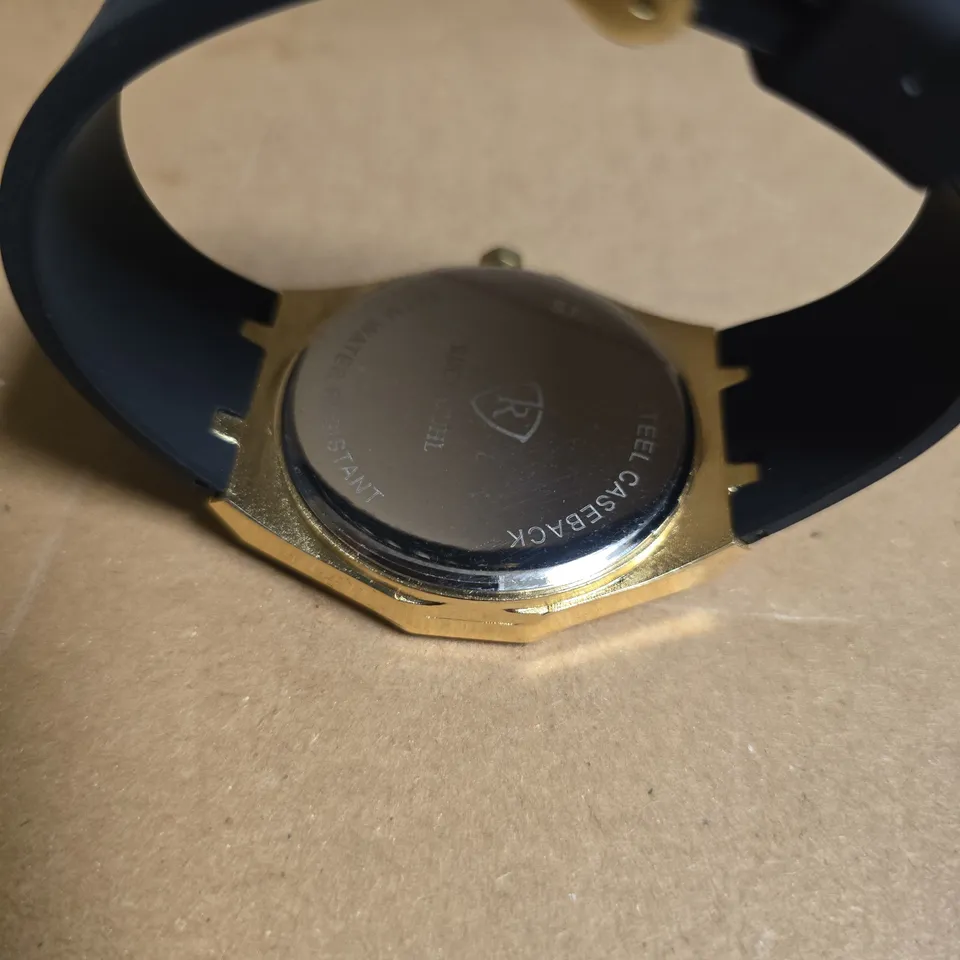 RUCKSTUHL BLACK RUBBER STRAP WRISTWATCH WITH GOLD COLOUR FRAME AND BLACK/SILVER COLOUR FACE
