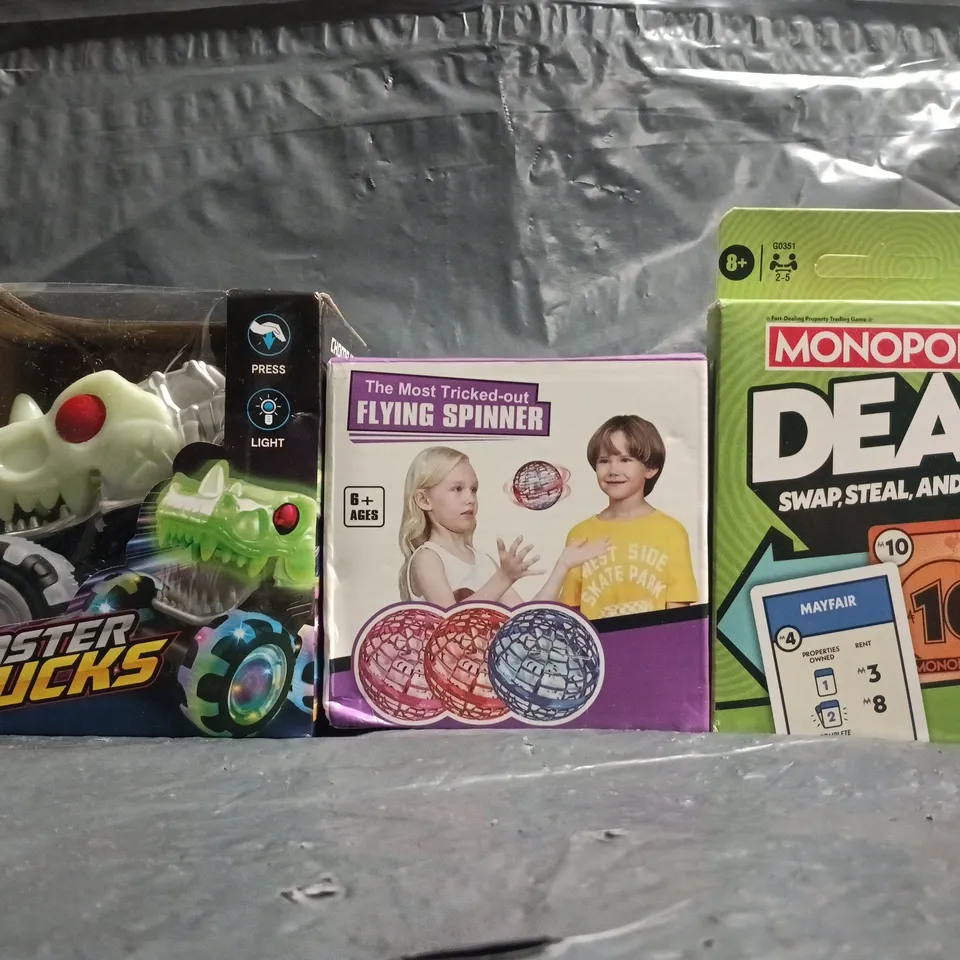 BOX OF APPROXIMATELY 20 ASSORTED TOYS AND GAMES TO INCLUDE MONOPOLY DEAL, MONSTER TRUCKS TOY ETC - COLLECTION ONLY