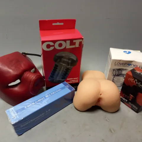 APPROXIMATELY 12 ASSORTED ADULT TOYS & ACCESSORIES TO INCLUDE LOVEHONEY HUMMER WAND ATTACHMENT, COLT BEADED STROKER, FLESHLIGHT, ETC