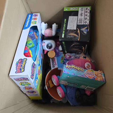 BOX OF APPROXIMATELY 8 ASSORTED TOYS INCLUDING ANIMAGIC , BABY WHEELS PARKING GARAGE AND RC STUNT CAR
