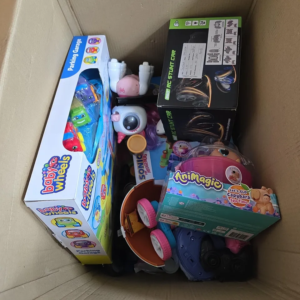 BOX OF APPROXIMATELY 8 ASSORTED TOYS INCLUDING ANIMAGIC , BABY WHEELS PARKING GARAGE AND RC STUNT CAR 
