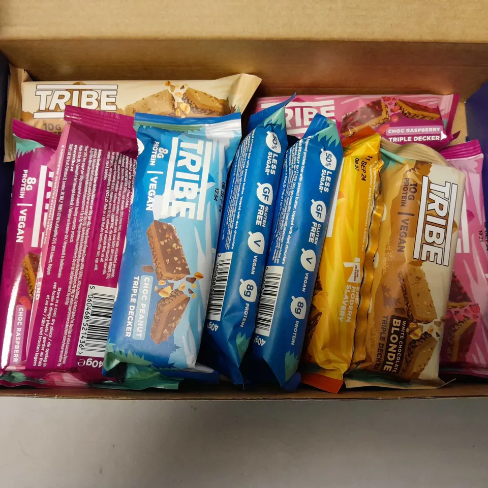 APPROXIMATELY 16 BOXED TRIBE VEGAN PROTEIN BARS TO INCLUDE WHITE CHOCOLATE BLONDIE, CHOC PEANUT TRIPLE DECKER, HONEYCOMB TRIPLE DECKER,, ETC