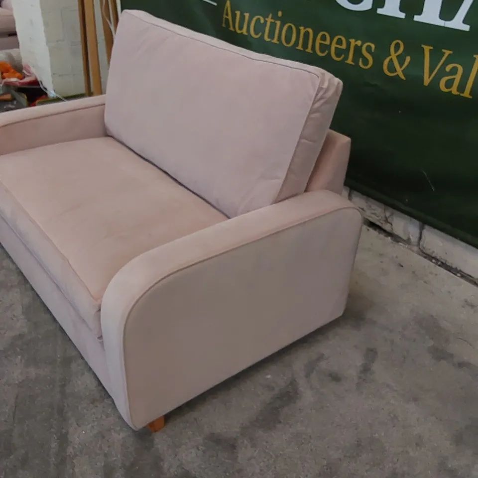 THE DUNSMORE LOVE SEAT SOFA BED UPHOLSTERED IN PETAL PINK FABRIC 