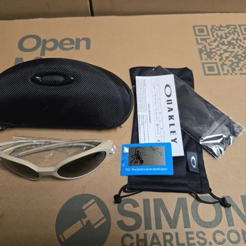 PAIR OF OAKLEY GLASSES WITH BEIGE FRAMES AND CARRY CASE