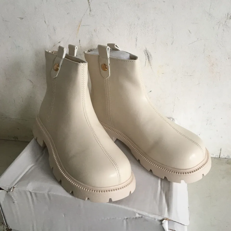 BOXED PAIR OF SIZE 37 CREAM FAUX LEATHER BOOTS