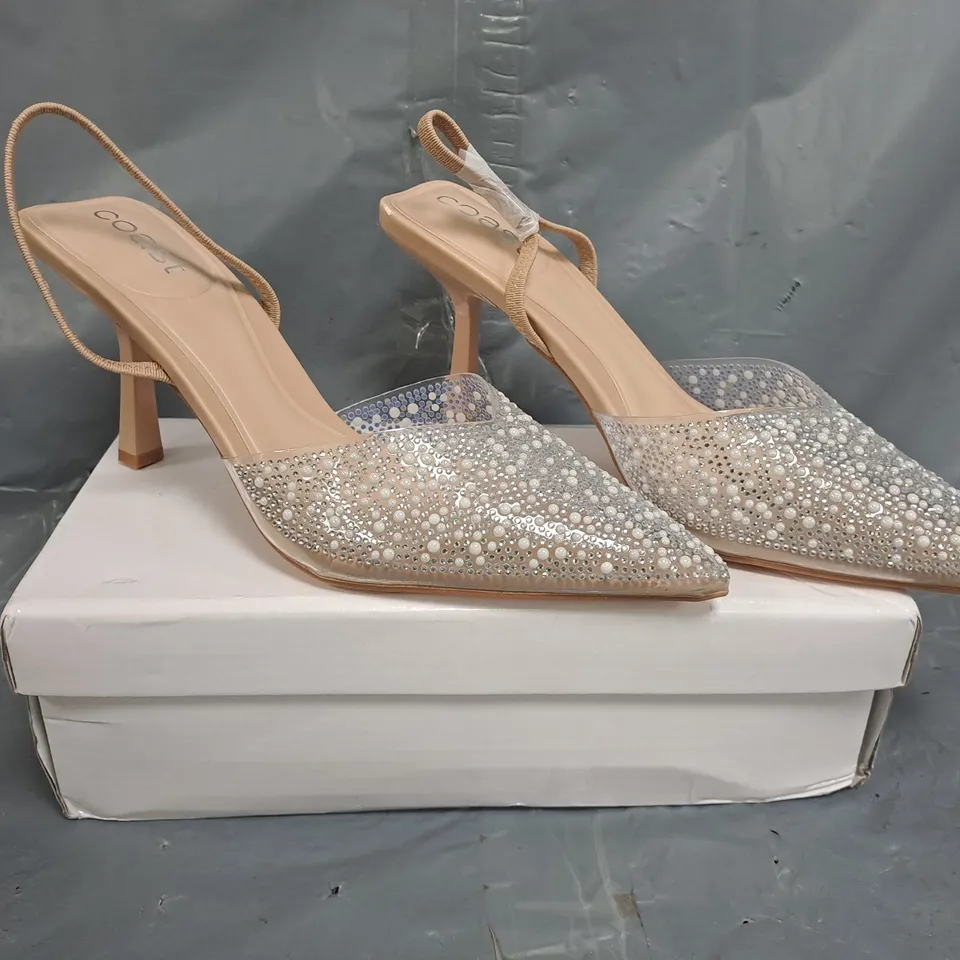 BOXED PAIR OF COAST POINTED TOE HEELS IN CLEAR W. JEWEL EFFECT SIZE 6