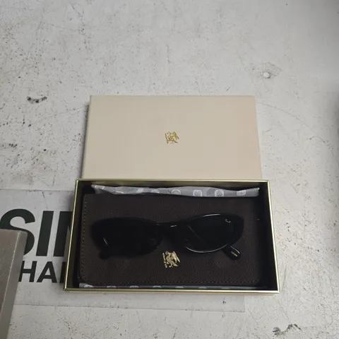 PRAGNELL SUNGLASSES IN BLACK FRAME WITH BROWN LEATHER CASE AND GOLD CREST ON TEMPLE 
