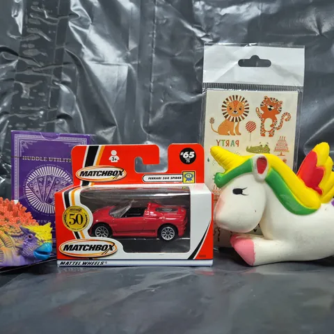 APPROXIMATELY 10 ASSORTED TOYS AND GAMES TO INCLUDE PLAYING CARDS, MATCHBOX TOY CAR, ETC