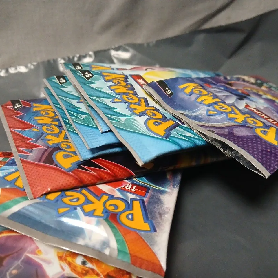 LOT OF APPROXIMATELY 24 PACKS OF ASSORTED POKEMON 10-PACKS TRADING CARDS