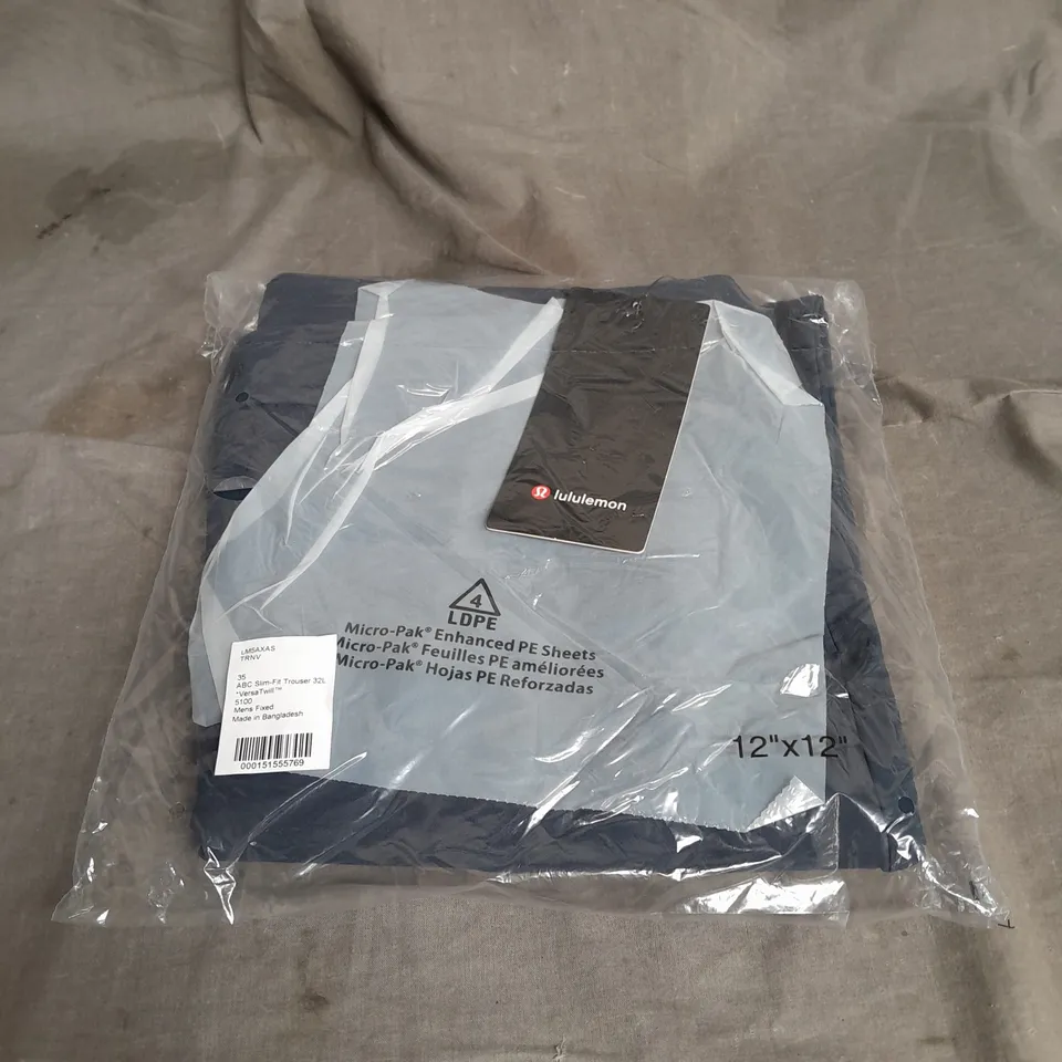 BAGGED LULULEMON ABC SLIM FIT VERSATWILL TROUSER IN NAVY SIZE W35 L32