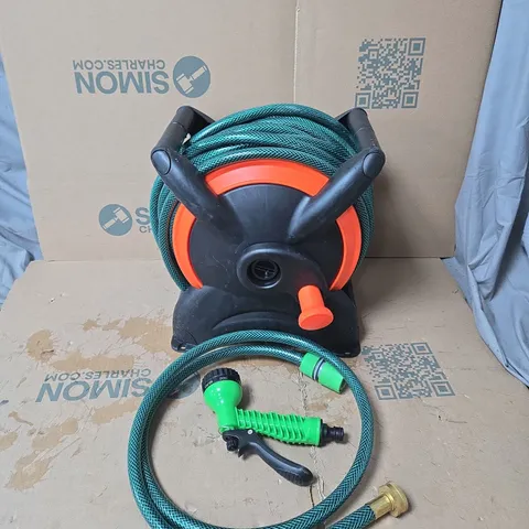 GARDEN HOSE REEL WITH GREEN HOSE AND ATTACHMENTS