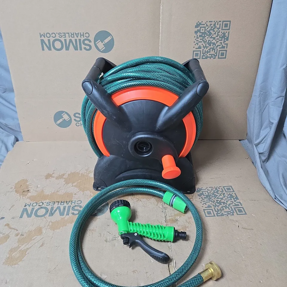 GARDEN HOSE REEL WITH GREEN HOSE AND ATTACHMENTS