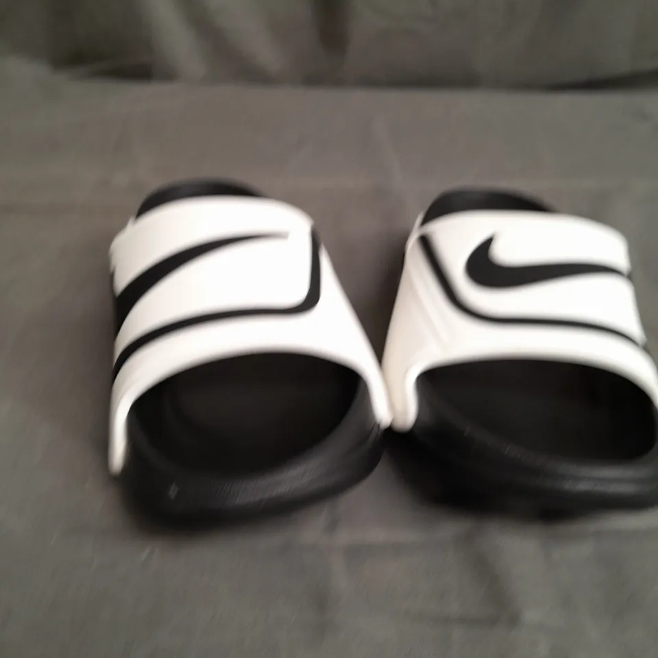 PAIR OF NIKE BLACK/WHITE SANDALS SIZE 42
