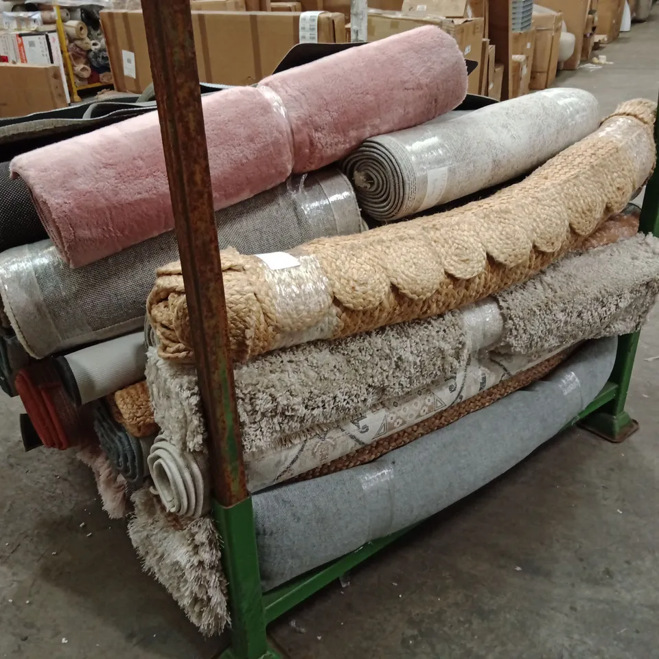 STILLAGE OF APPROXIMATELY 25 DESIGNER RUGS