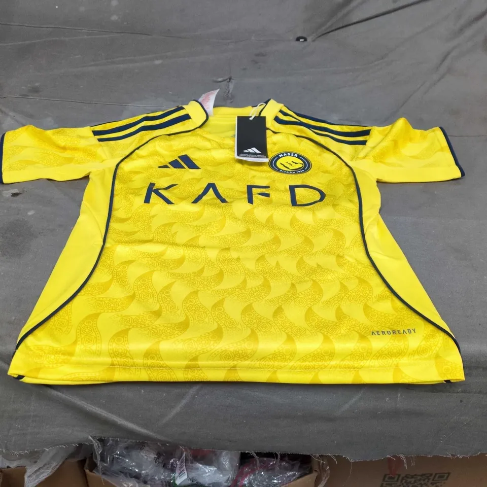UK 7-8Y ADIDAS NASSR RIYADH 1955 RONALDO 7 YOUTH FOOTBALL JERSEY – YELLOW