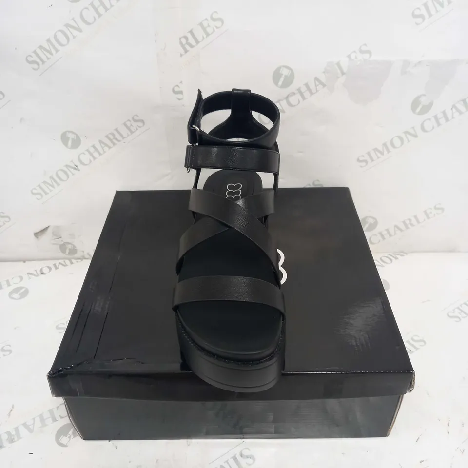 BOXED PAIR OF KOI FOOTWEAR CRIX CHUNKY BLATFORM SANDALS IN BLACK PU - SIZE 6