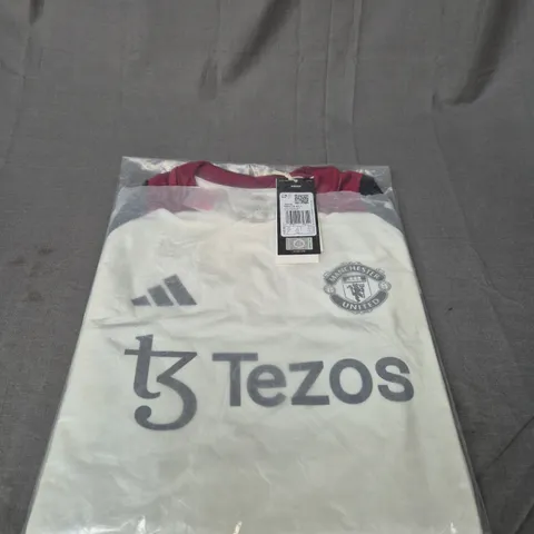 BAGGED MANCHESTER UNITED FC TRAINING TIOP SIZE 13/14 YEARS