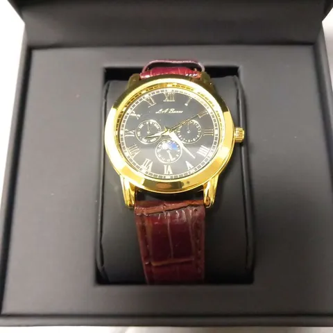 BOXED LA BANUS GOLD FRAMED WRIST WATCH WITH BLACK FACE AND MAROON STRAPS