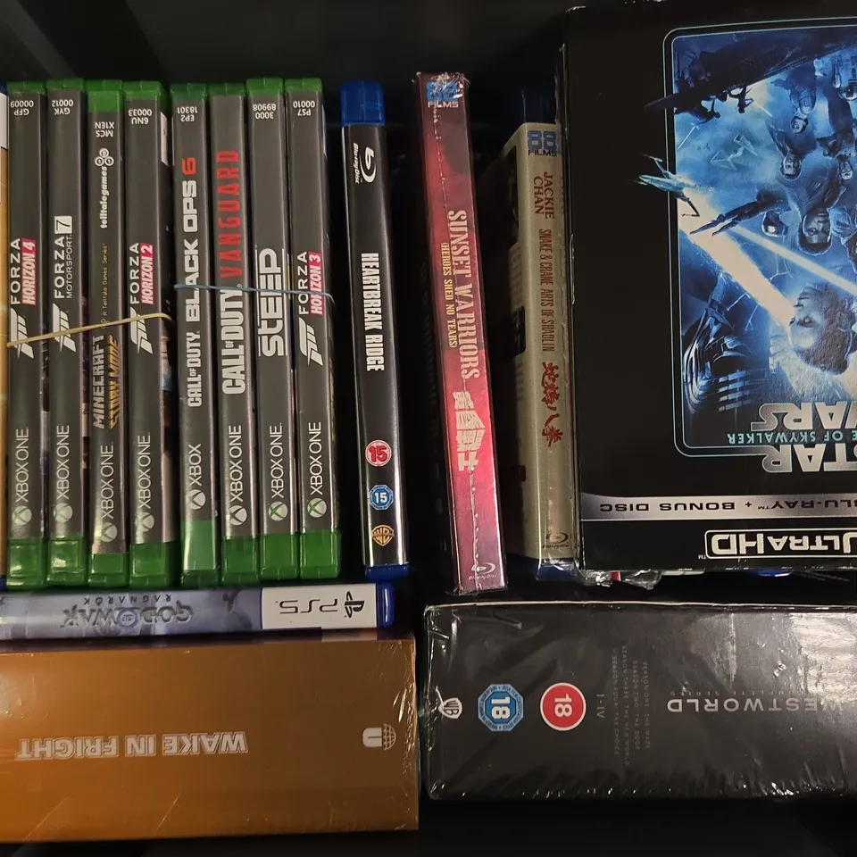 APPROXIMATELY 25 ASSORTED DVDS AND VIDEO GAMES FOR VARIOUS CONSOLES TO INCLUDE TEKKEN 8, JOHN WICK CHAPTERS 1-4, THE MONKEY, ETC