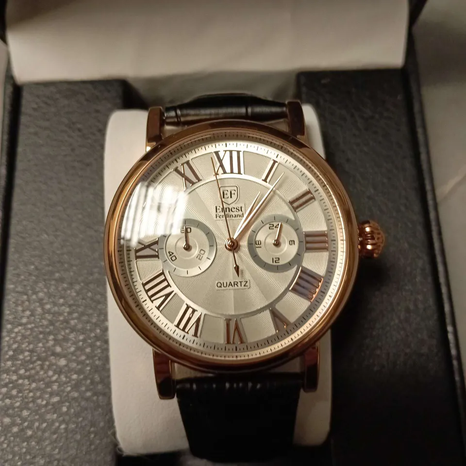ERNEST FERDINAND QUARTZ WRISTWATCH – ROSE GOLD TONE CASE, ROMAN NUMERALS, BLACK LEATHER STRAP (BOXED)