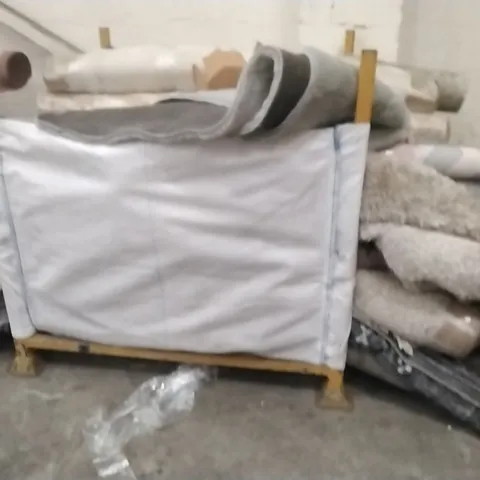 STILLAGE OF APPROXIMATELY 25 DESIGNER RUGS