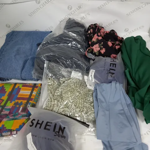 LARGE BOX OF ASSORTED CLOTHING ITEMS IN VARIOUS COLOURS AND SIZES INCLUDING TROUSERS , TOPS AND JUMPERS