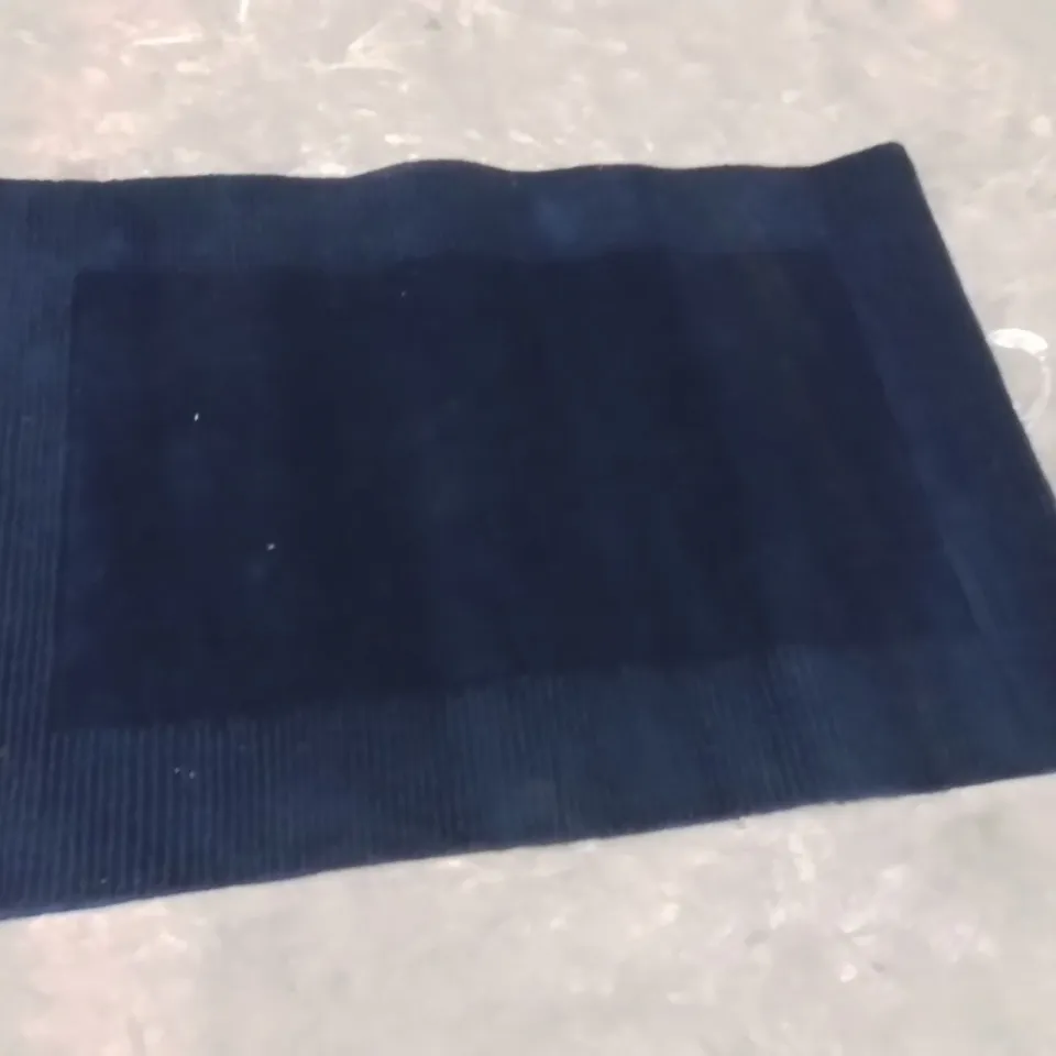 STILLAGE OF APPROXIMATELY 20 QUALITY DESIGNER RUGS