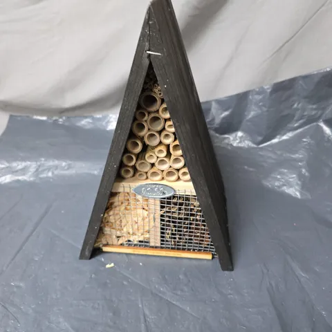 TRIANGULAR WOODEN INSECT HOTEL WITH BAMBOO TUBES; GARDEN BEE HOUSE