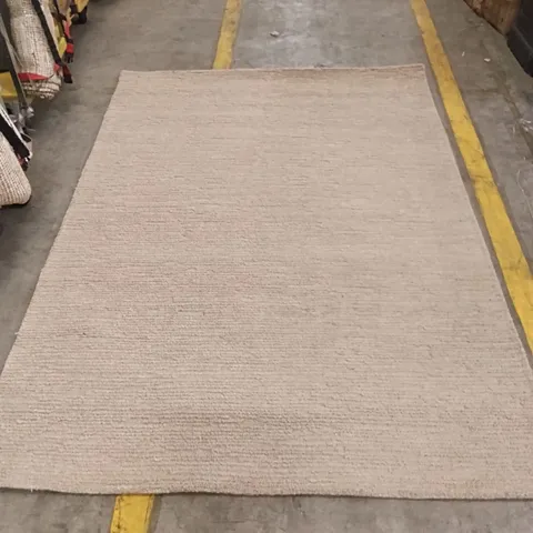 BEIGE TEXTURED RECTANGULAR RUG APPROXIMATELY 228 CM X 160 CM