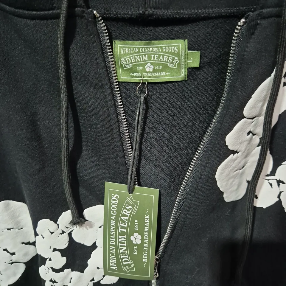 DENIM TEARS X AFRICAN DIASPORA GOODS HOODIE – BLACK ZIP HOODIE WITH WHITE FLORAL PRINT