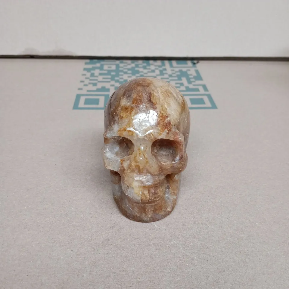 TOTE OF APPROXIMATELY 10 ASSORTED ITEMS INCLUDING SKELETON HEAD, ORANGE RIBBON AND MEASURING CUPS