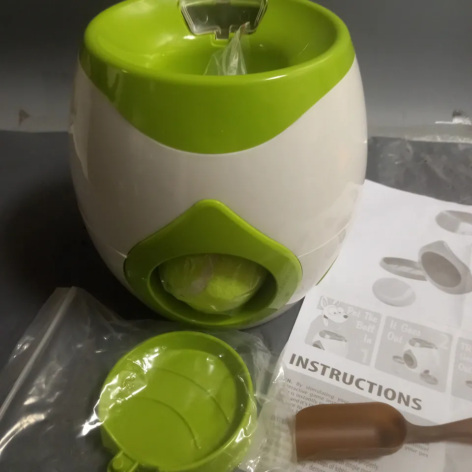 TENNIS BALL PET TREAT DISPENSER AND GAME