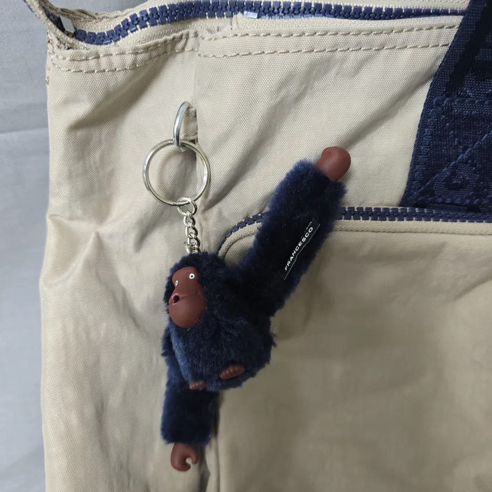 KIPLING BEIGE TOTE BAG WITH NAVY HANDLES AND MONKEY KEYCHAIN