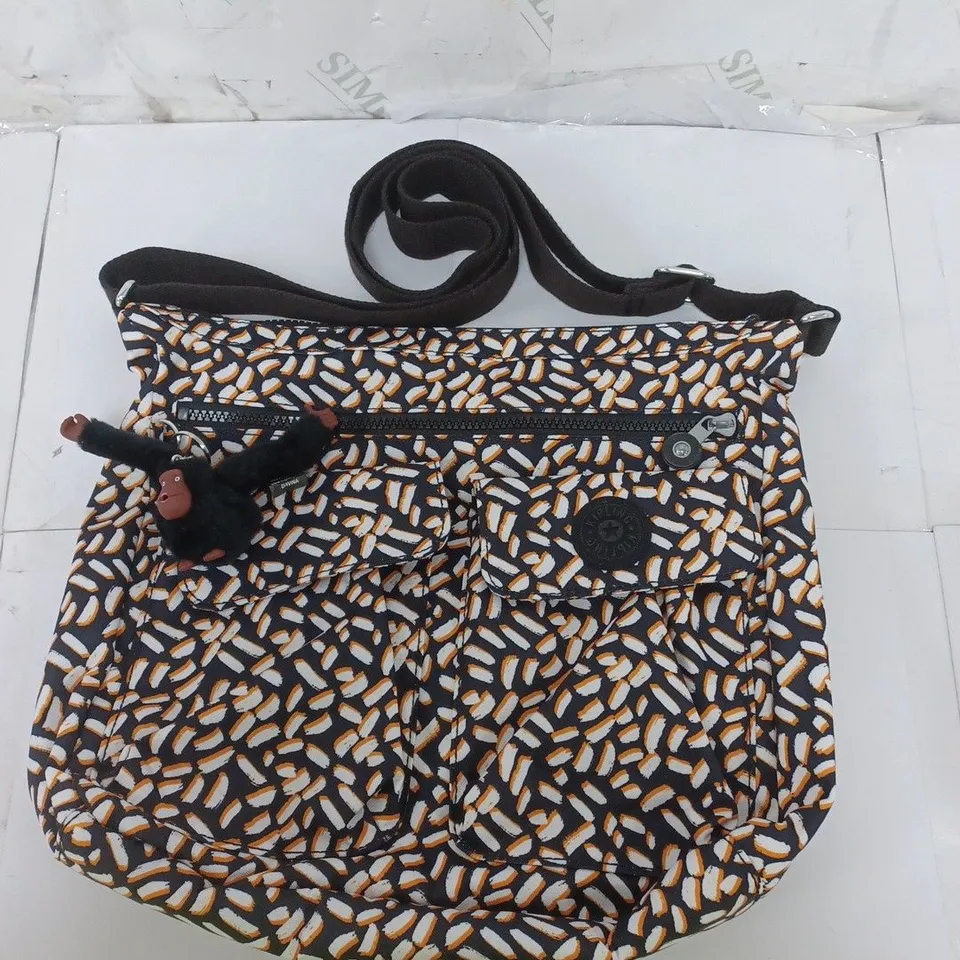 KIPLING SHOULDER BAG IN BLACK/WHITE/ORANGE PRINT WITH MONKEY ACCESSORY 