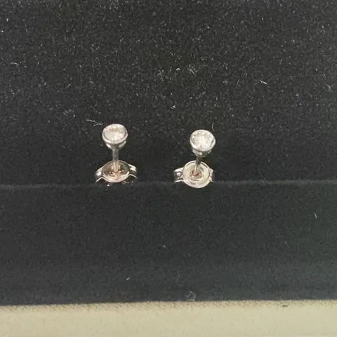 18CT WHITE GOLD RUB-OVER STUDS SET WITH NATURAL DIAMONDS